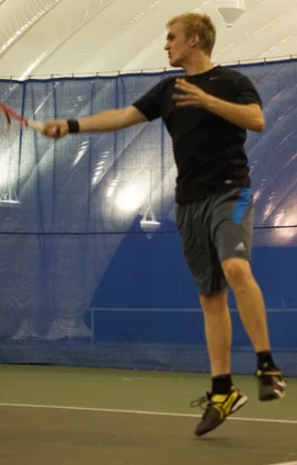 Matt hitting a forehand in tennis